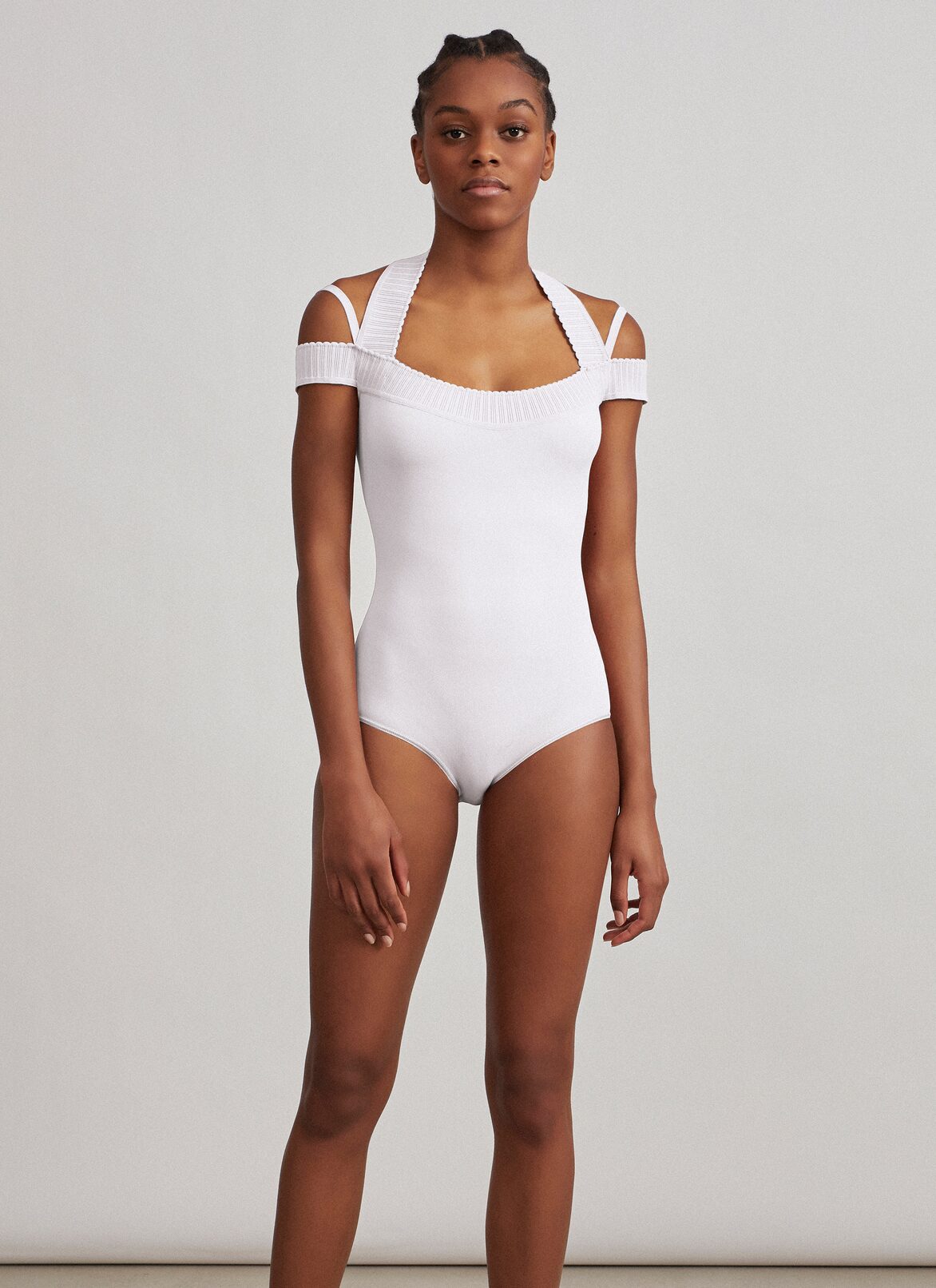 Cold-shoulder knit bodysuit 
 ALAÏA WHITE COLD-SHOULDER KNIT BODYSUIT